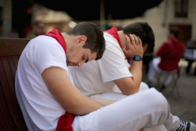 PAMPLONA SPAIN JULY 09 Revellers take an afternoon siesta sleeping off the effects of partying during the fourth day of the San Fermin Running Of The Bulls festival on July 9 2014 in Pamplona Spain The annual Fiesta de San Fermin made famous by the 1926 novel of US writer Ernest Hemingway The Sun Also Rises involves the running of the bulls through the historic heart of Pamplona Photo by Christopher FurlongGetty Images